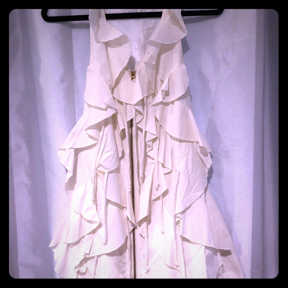 Sleeveless top with dramatic flare